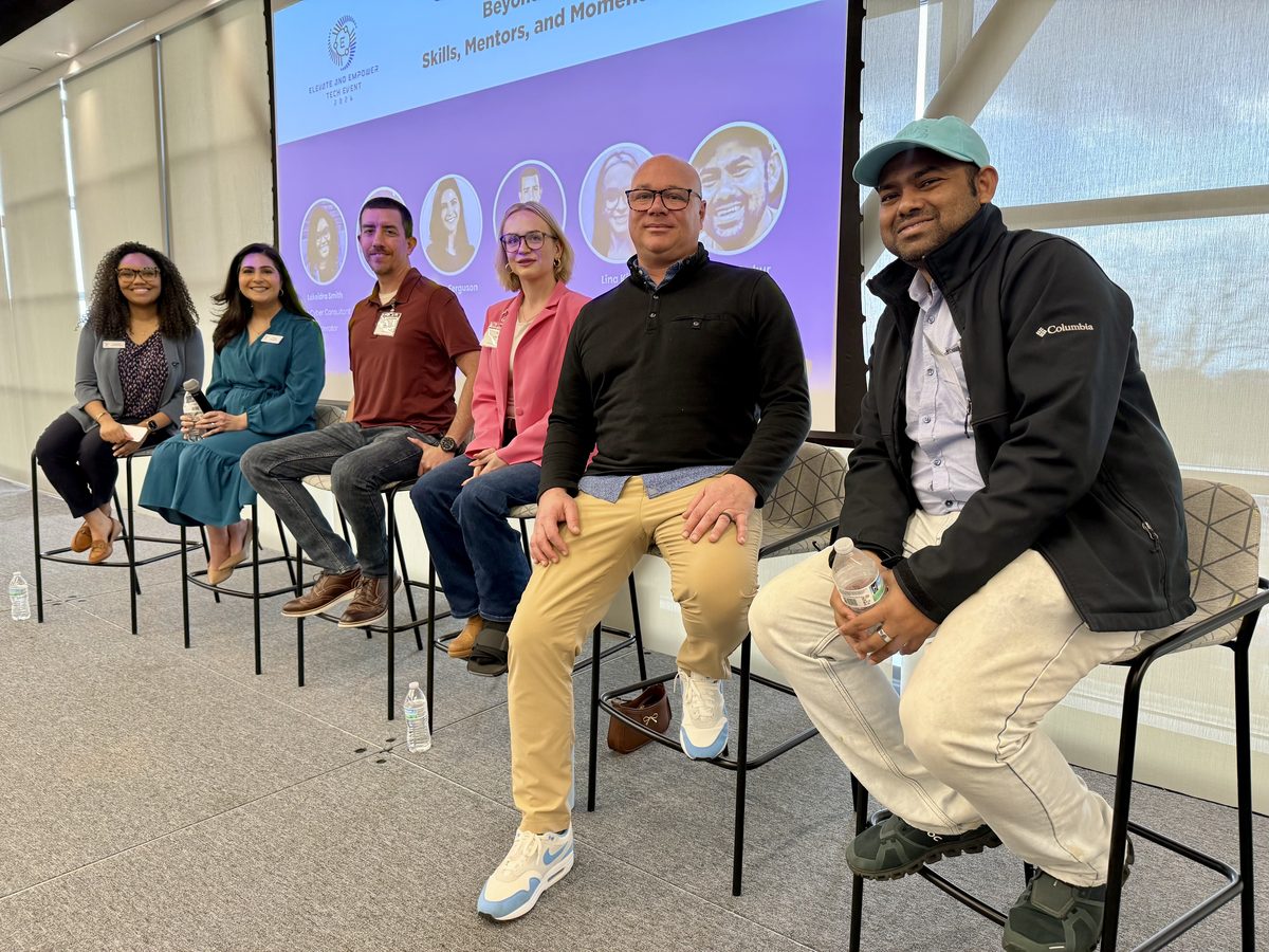 A diverse panel of speakers discussing tech careers at an Elevate & Empower event